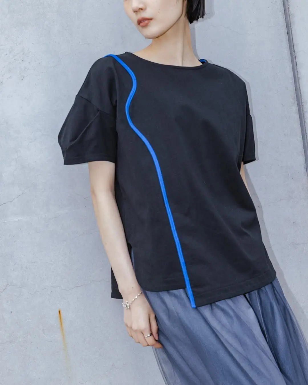 casual summer t-shirt outfit for women 2026 Modern Black Tee with Subtle Design Detail and Flowing Skirt