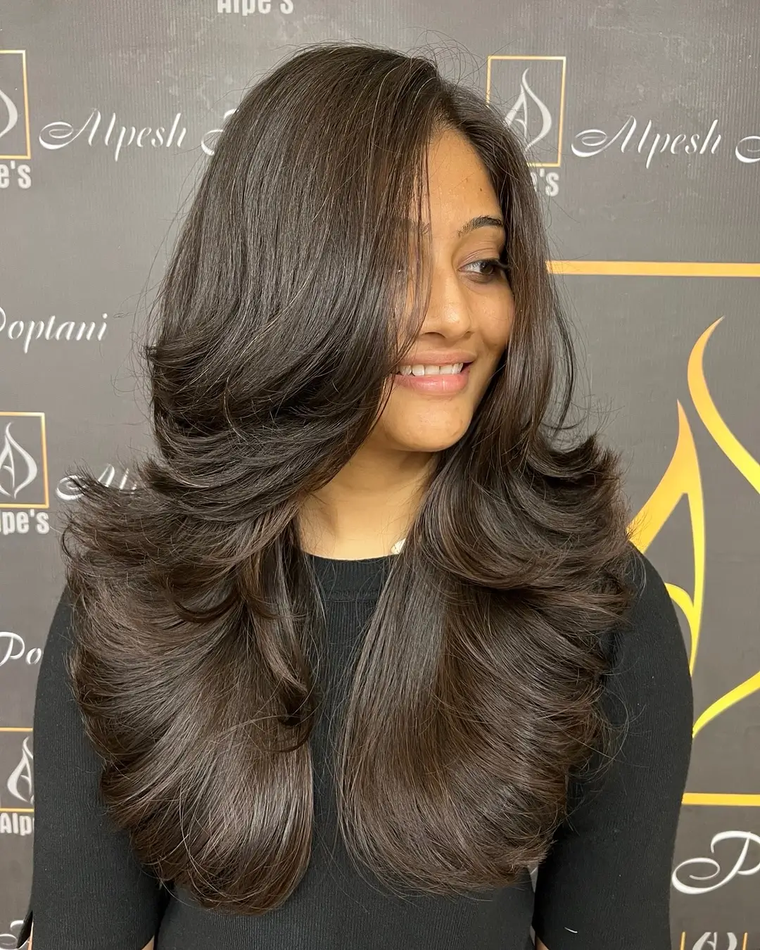 chic summer haircut 2026 Long voluminous layers with polished movement