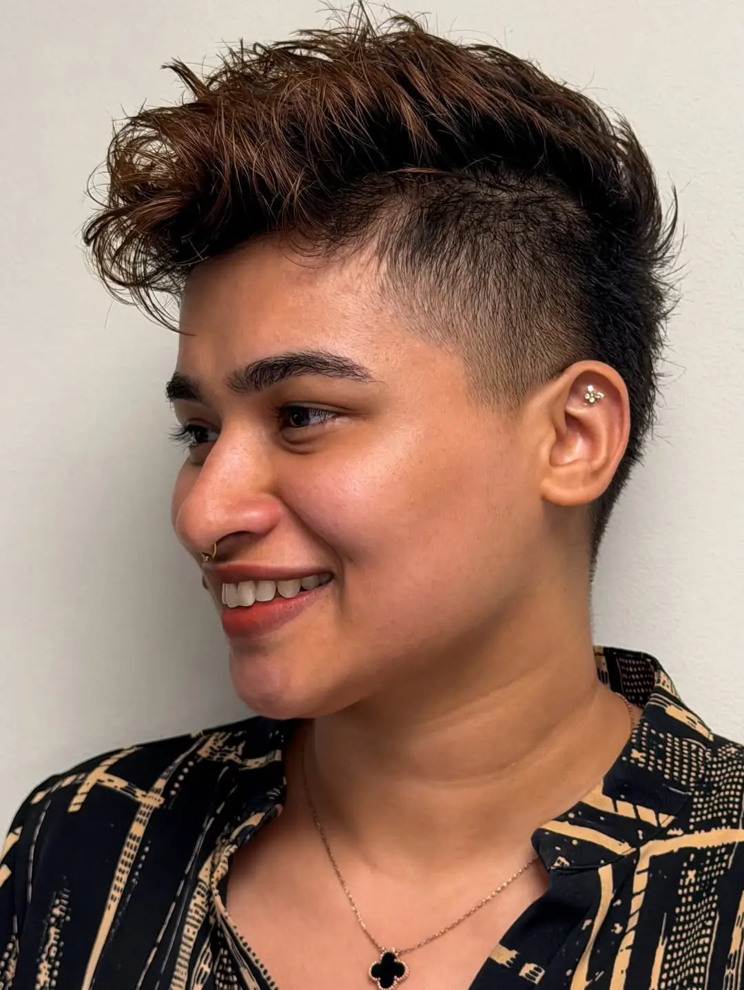 chic summer haircut 2026 Textured Undercut with Soft Rocker Energy