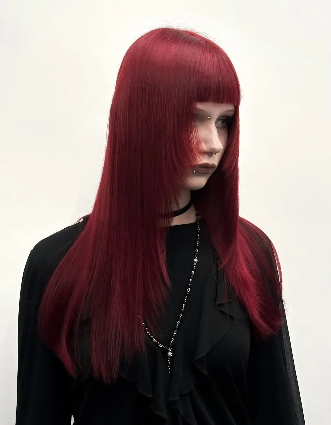 chic summer haircut 2026 Glossy Crimson Length with Graphic Fringe