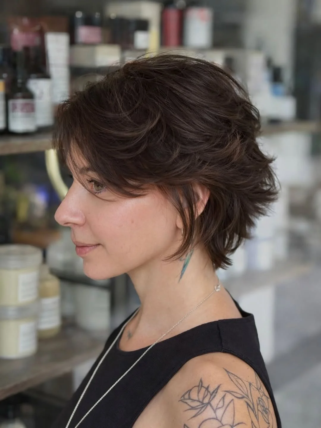 cute summer bixie haircut 2026 Textured Brunette Bixie with Short Funky Layers