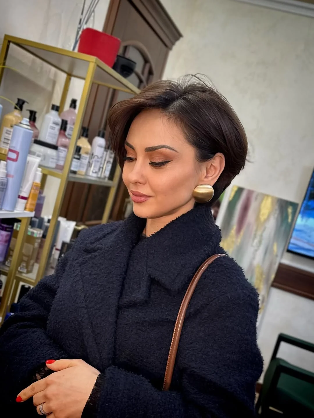 cute summer short haircuts 2026 Sleek Side Swept Brunette Pixie