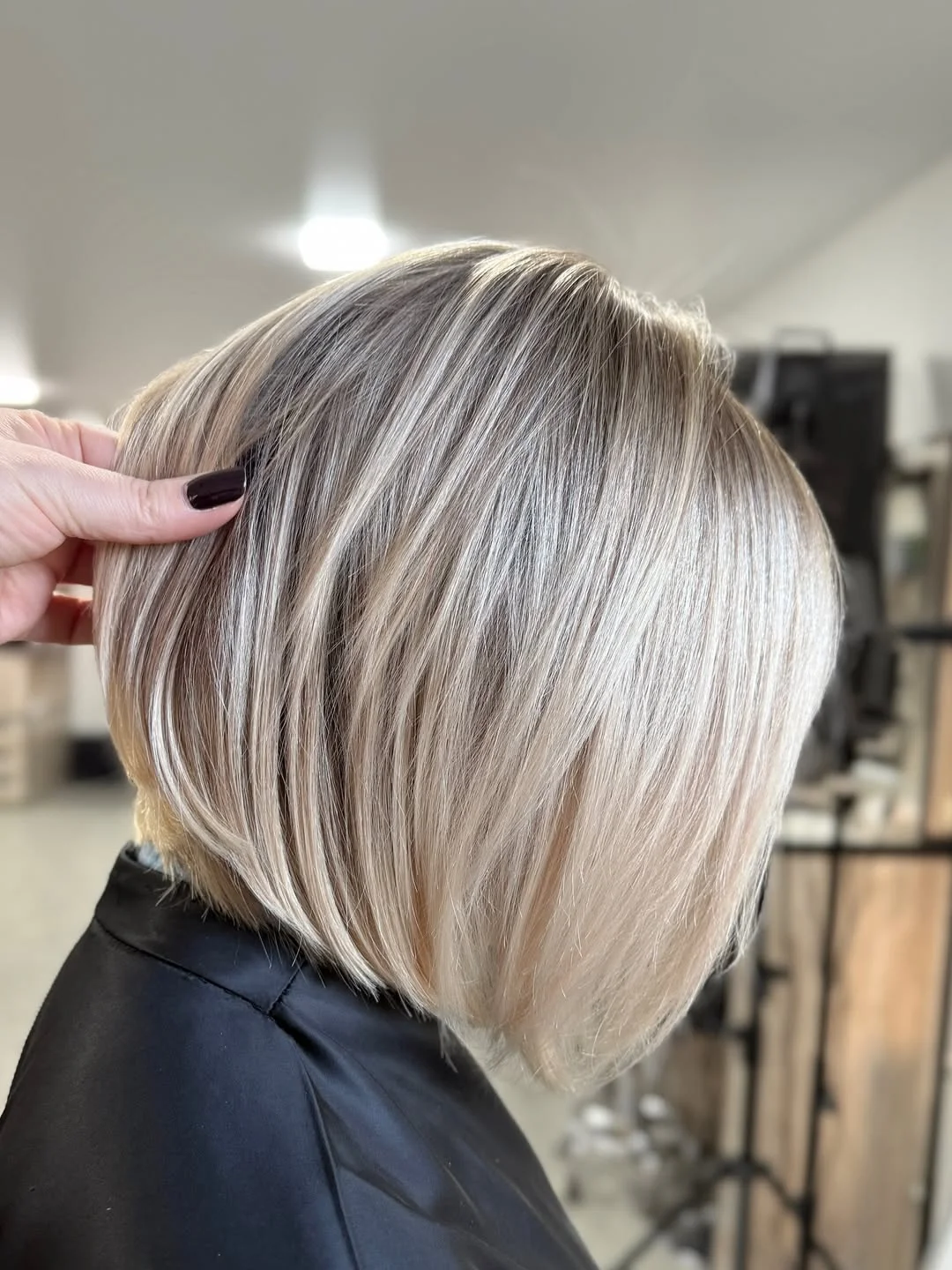 cute summer short haircuts 2026 Cool Toned Blonde Bob with Smooth Layers