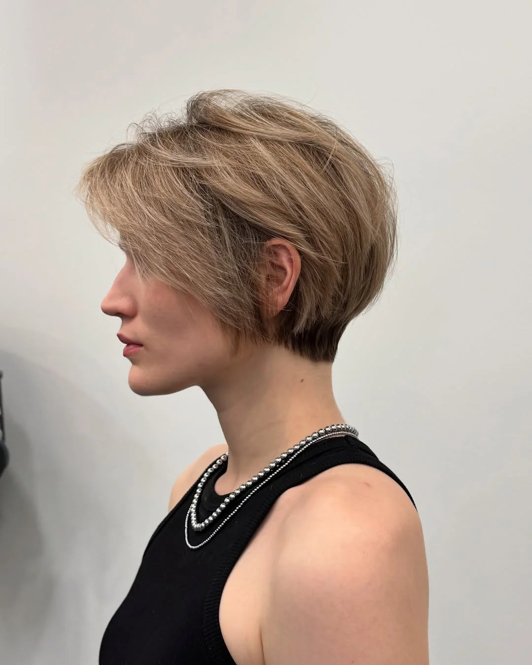 cute summer short haircuts 2026 Layered Blonde Pixie with Tapered Nape
