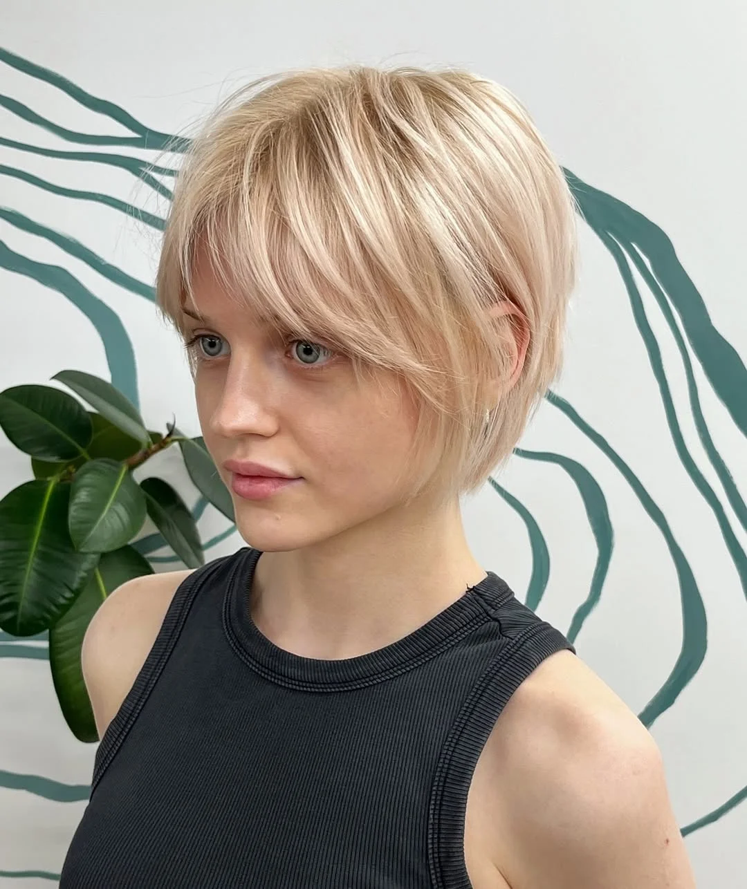 cute summer short haircuts 2026 Feathered Short Crop with Light Bangs