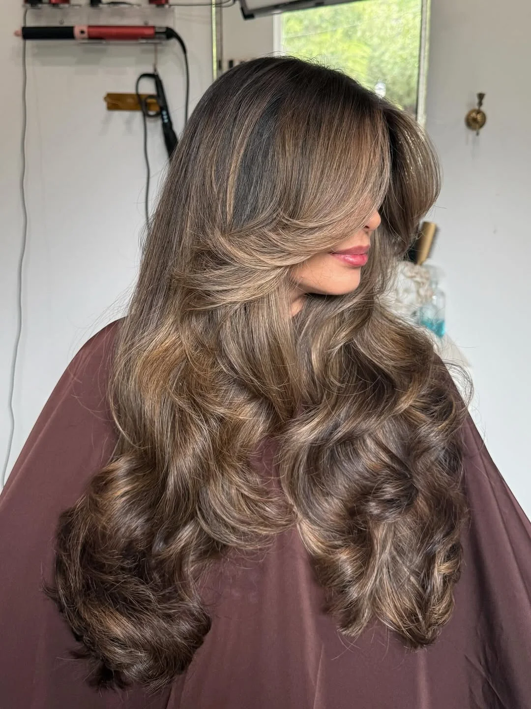 face-framing summer butterfly haircut 2026 Dimensional Brunette Waves with Full Butterfly Drama