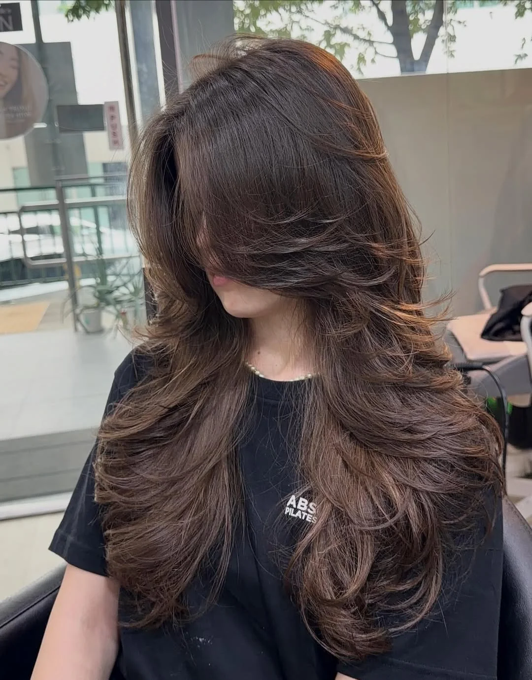 face-framing summer butterfly haircut 2026 Glossy Espresso Butterfly Layers with Full Volume