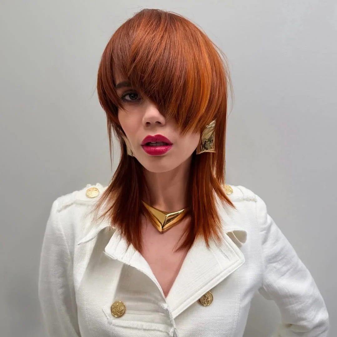 face-framing summer haircuts with bangs 2026 Edgy Copper Shag with Dramatic Fringe