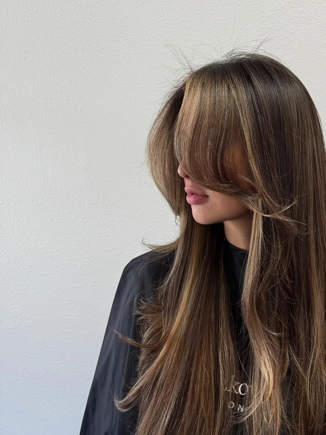 face-framing summer haircuts with bangs 2026 Butterfly Layers with Face Framing Volume
