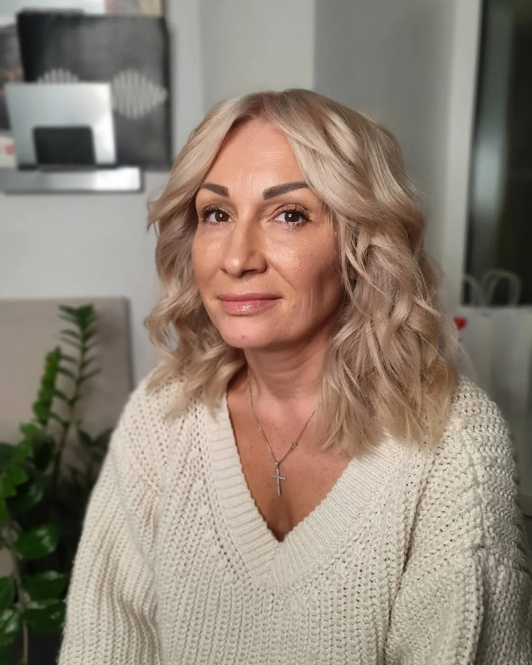 flattering summer haircuts for women over 50 2026 Soft Medium Length Shag With Summer Waves