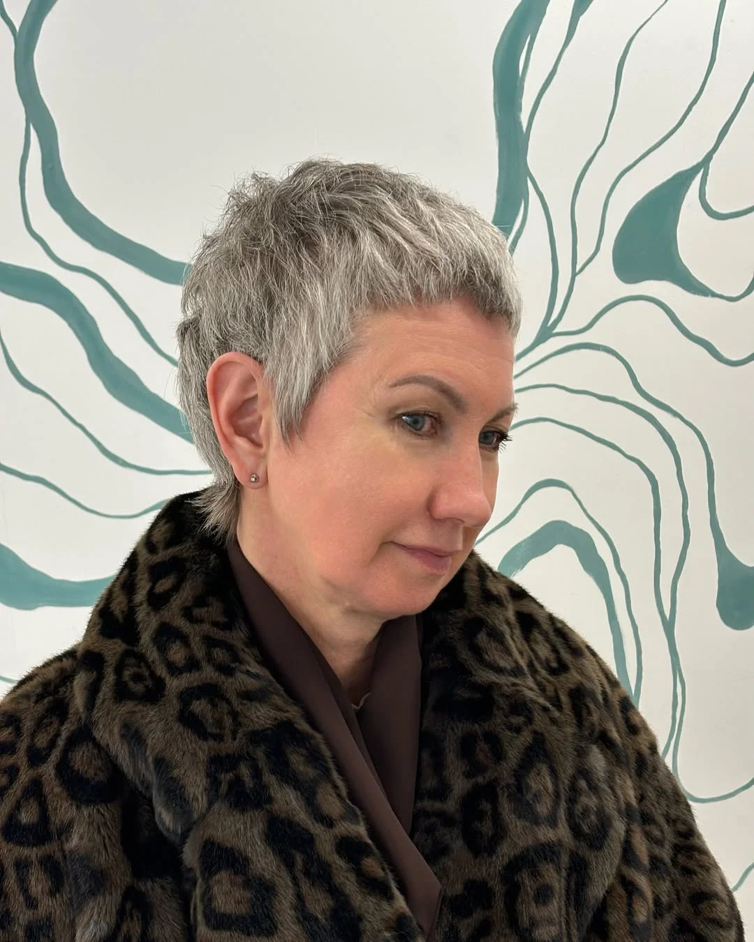 flattering summer haircuts for women over 50 2026 Ultra Short Pixie With Natural Grey Confidence