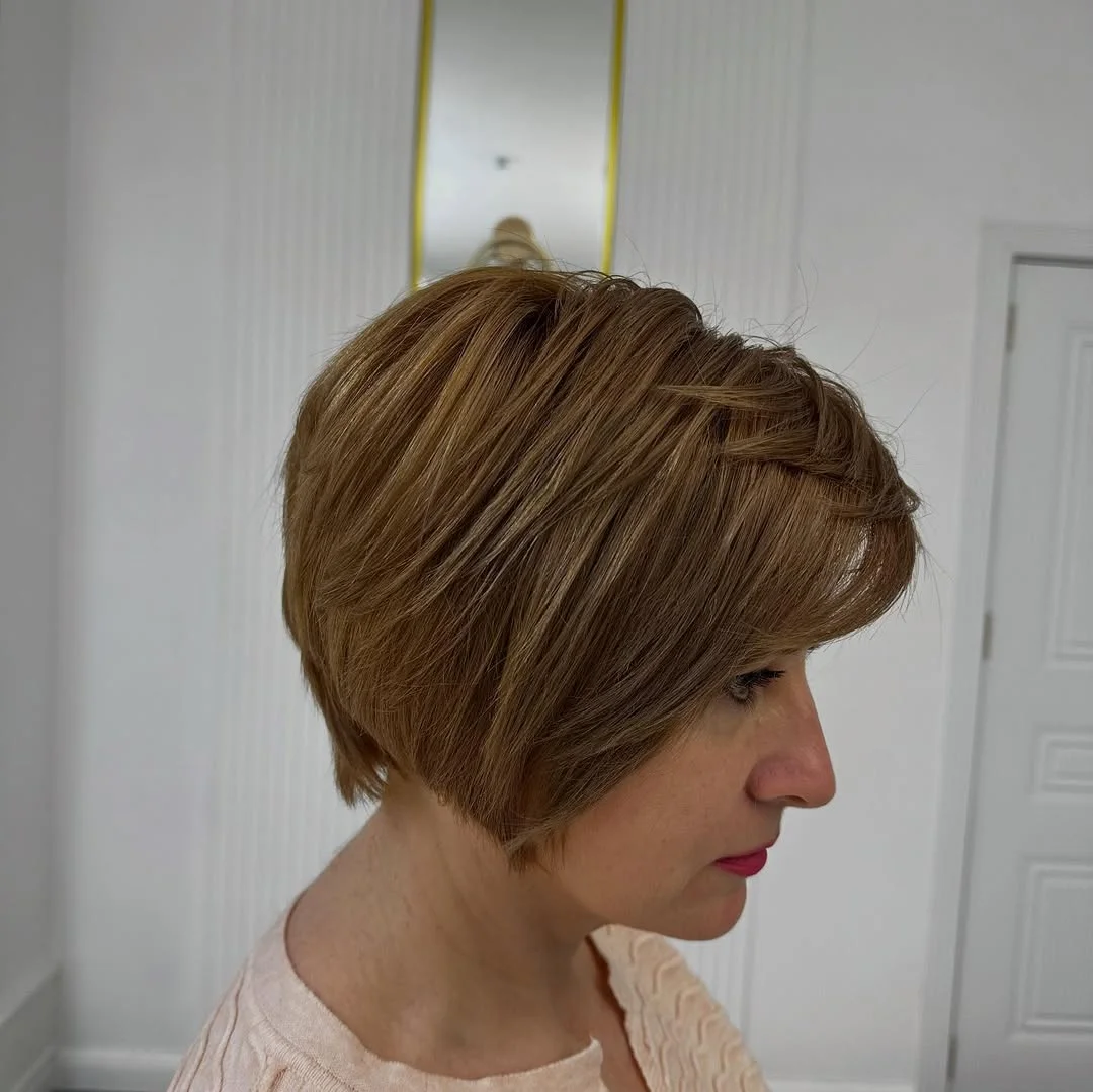 flattering summer haircuts for women over 50 2026 Classic Layered Bob with Natural Flow