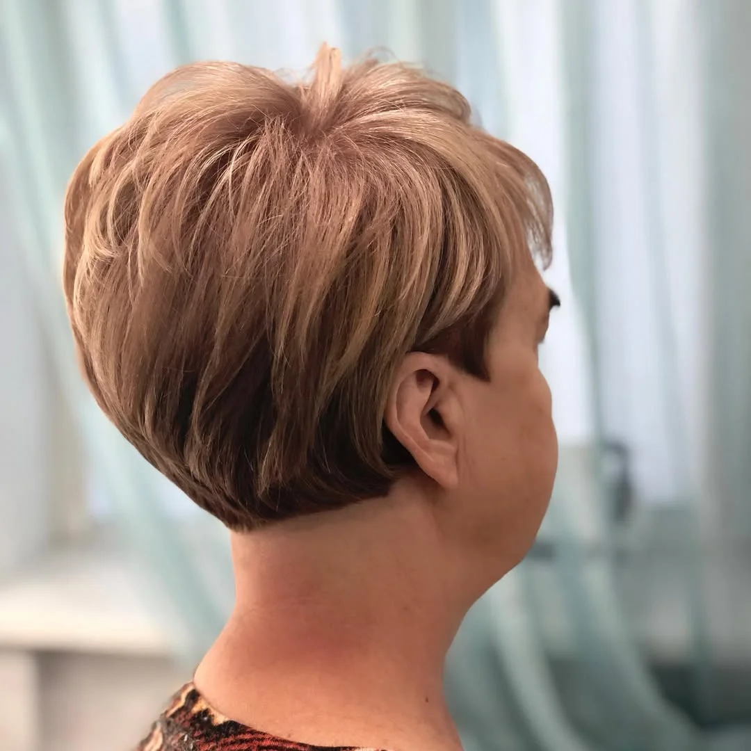 flattering summer haircuts for women over 50 2026 Stacked Wedge with Volume at the Crown