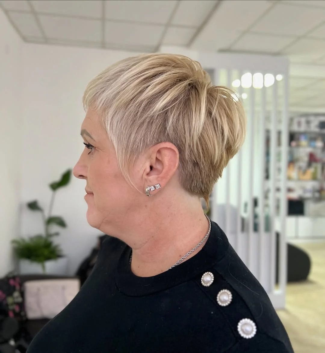 flattering summer haircuts for women over 60 2026 Feathered Blonde Short Pixie with Soft Volume