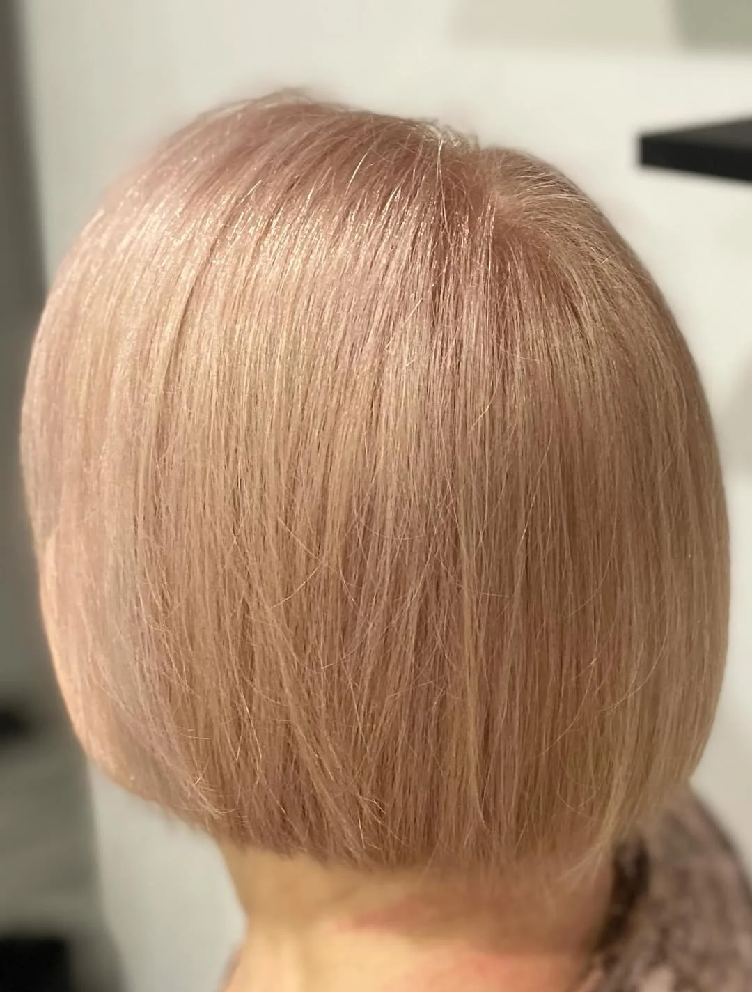 flattering summer haircuts for women over 60 2026 Precision Blonde Stacked Bob with Clean Lines