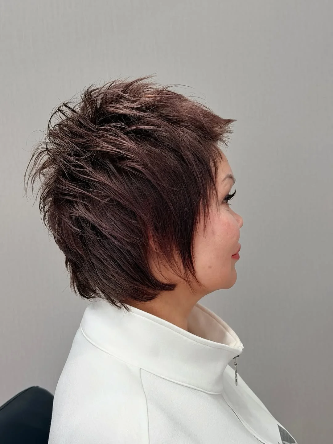 flattering summer haircuts for women over 60 2026 Textured Short Shag with Playful Movement