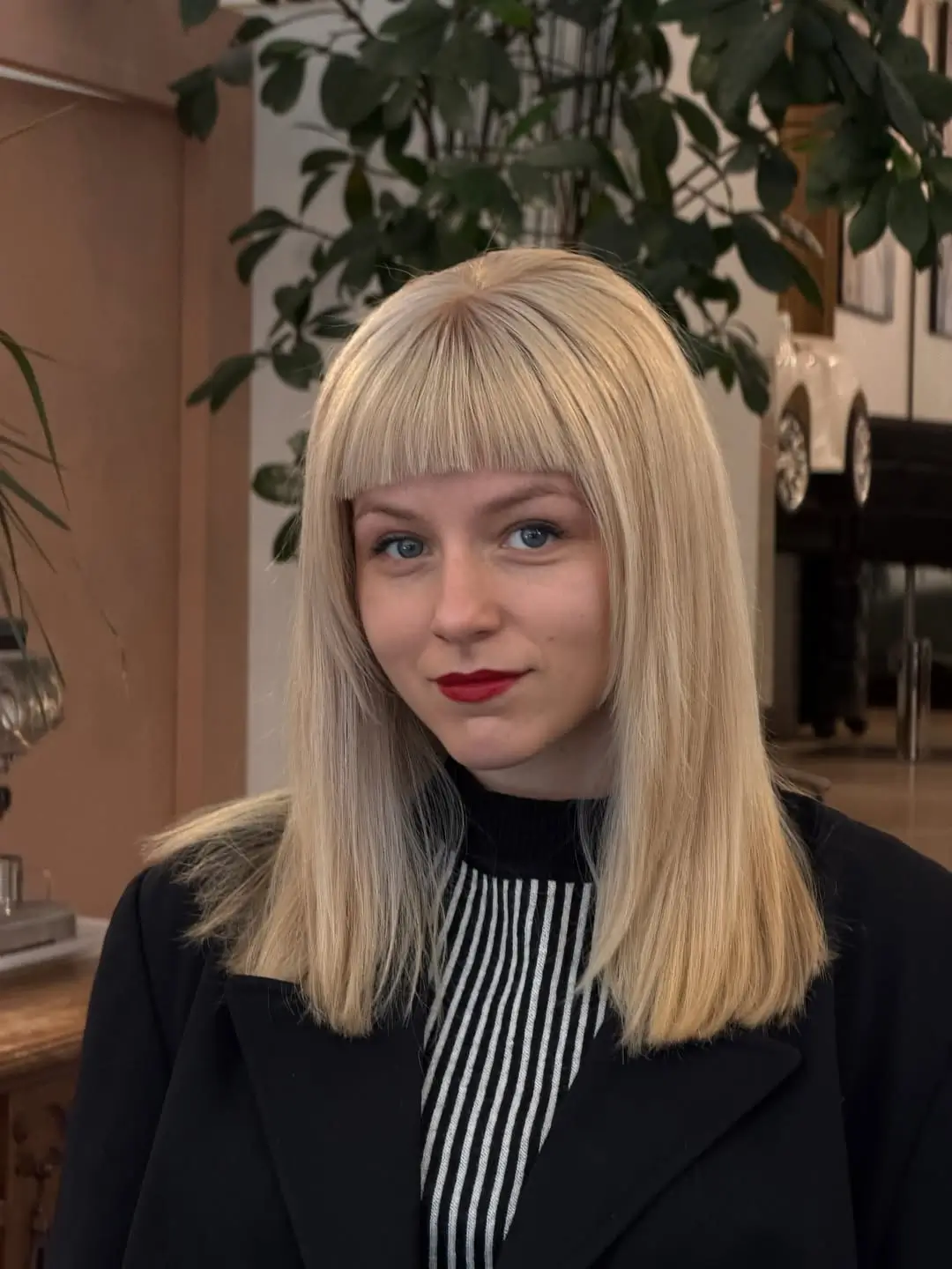 layered summer haircut for round face 2026 Blunt Bangs Meet Soft Length - The Bold Frame Comeback