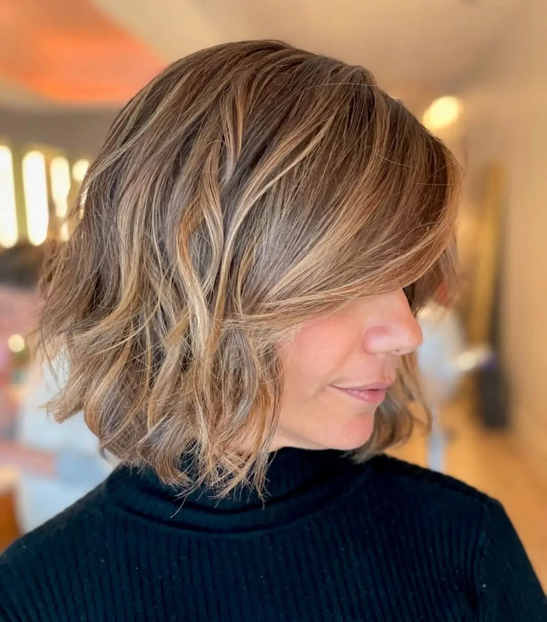 layered summer haircut for round face 2026 Textured Shoulder-Length Waves - The Undone Summer Classic
