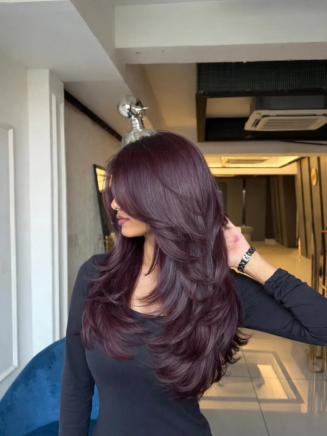 layered summer haircut for round face 2026 Deep Plum Long Layers with Dramatic Flow