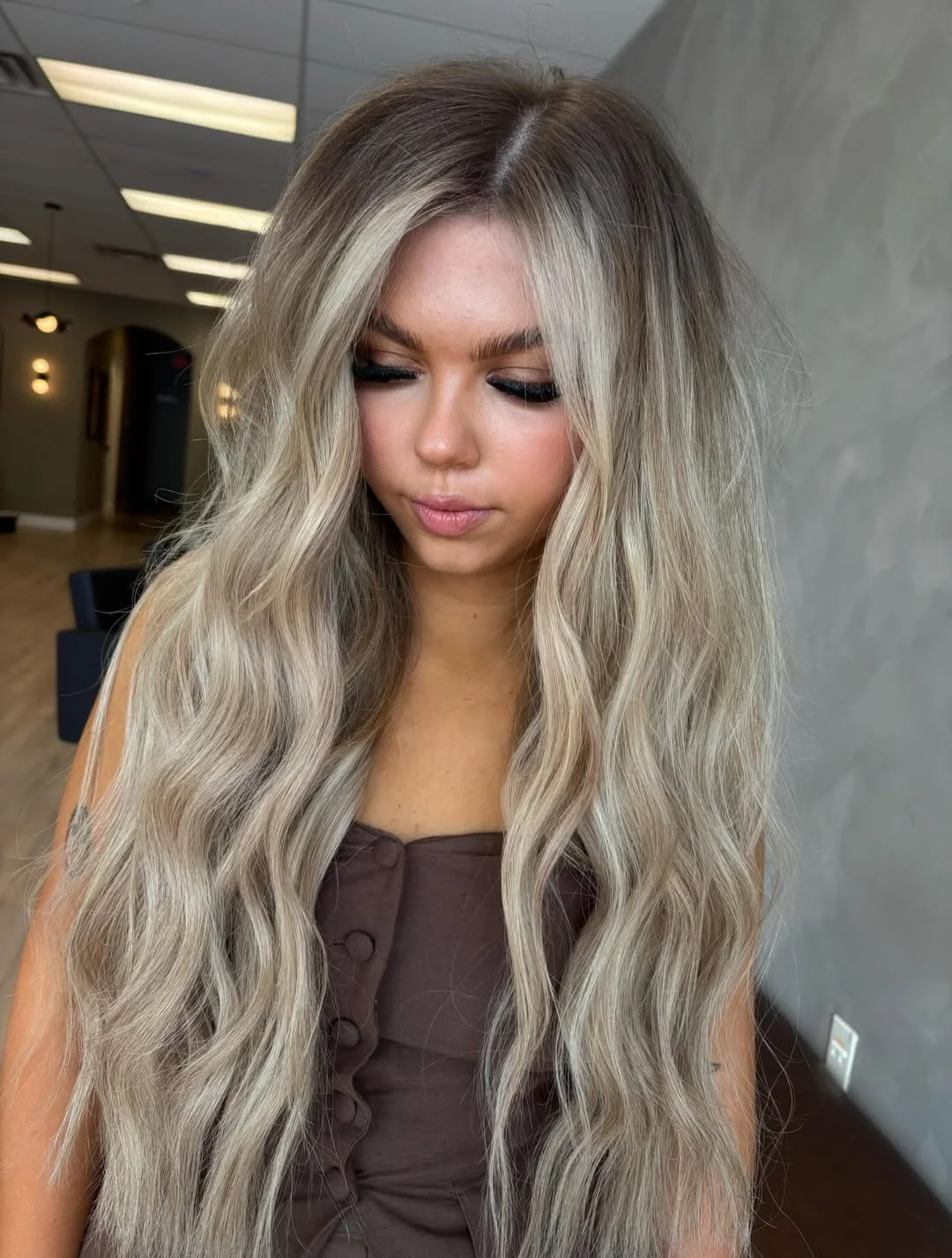 layered summer haircuts for fuller faces 2026 Cool Blonde Length With Airy Medium Texture