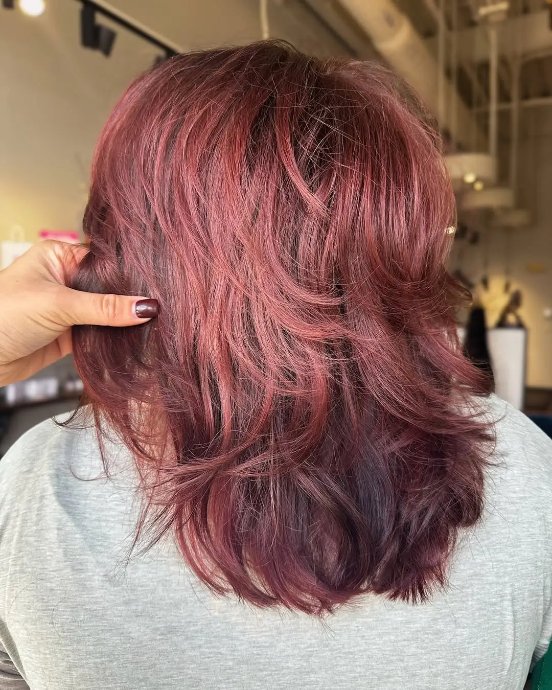 layered summer shag haircut 2026 Heavily Layered Burgundy Shag with Movement