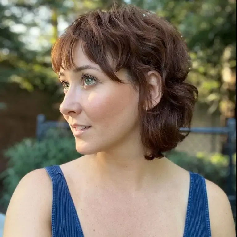 layered summer shag haircut 2026 Messy Textured Updo Shag with Soft Fringe