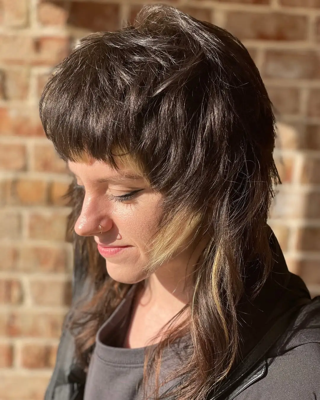 layered summer shag haircut 2026 Edgy Short Shag with Micro Bangs and Contrast
