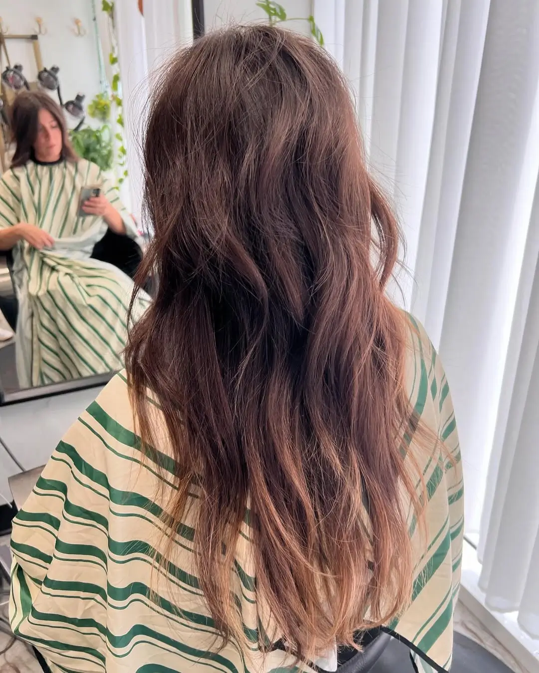 layered summer shag haircut 2026 Natural wavy shag with sunlit dimension
