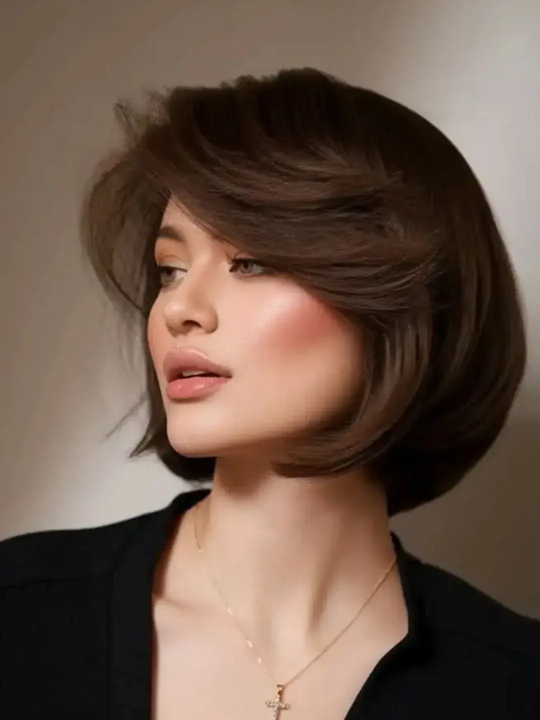sleek summer bob haircut 2026 Voluminous side swept bob with soft lift
