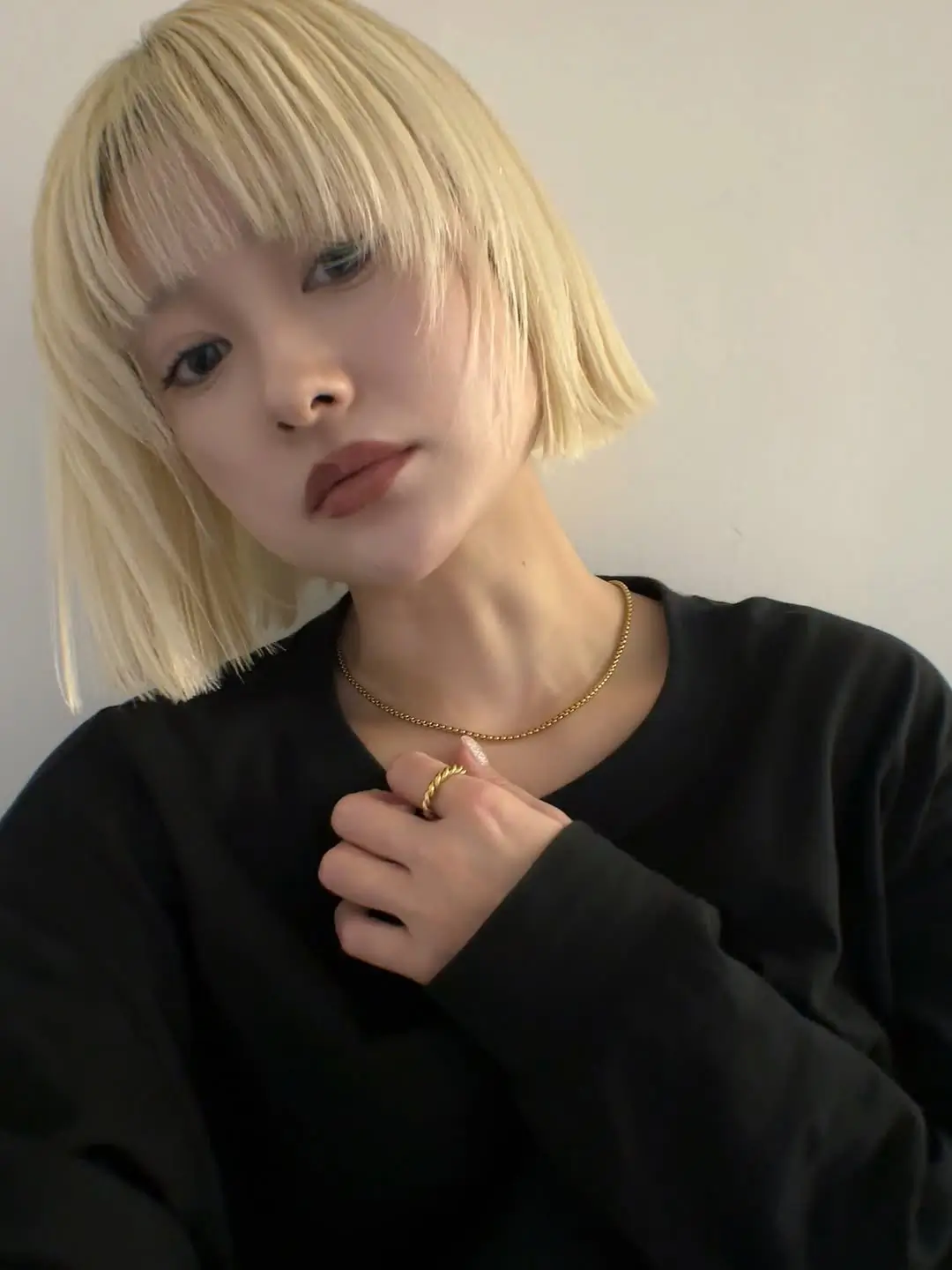 sleek summer bob haircut 2026 Blunt Blonde Bob with Full Bangs Statement