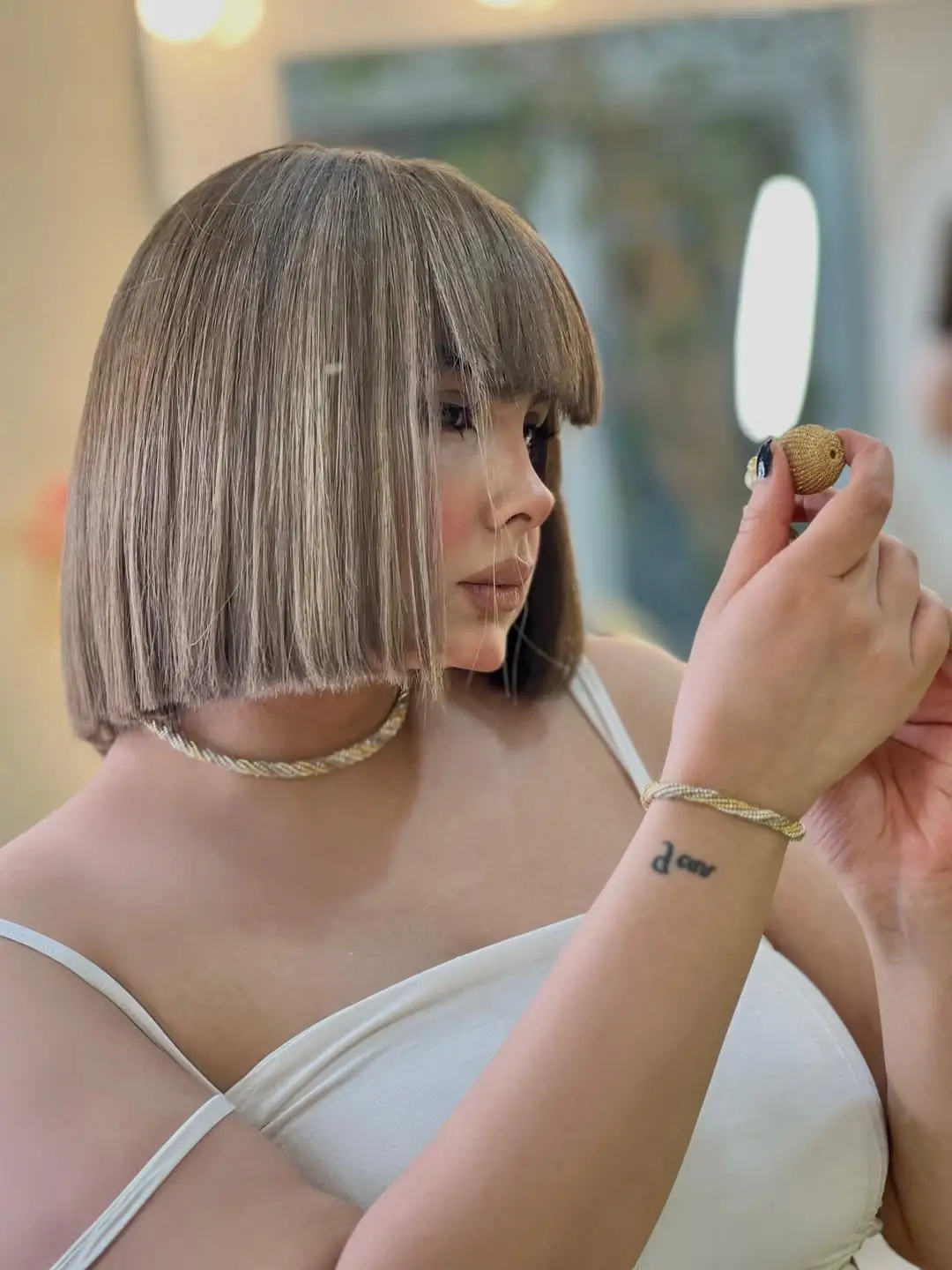 sleek summer bob haircut 2026 Bold blunt bob with full fringe attitude