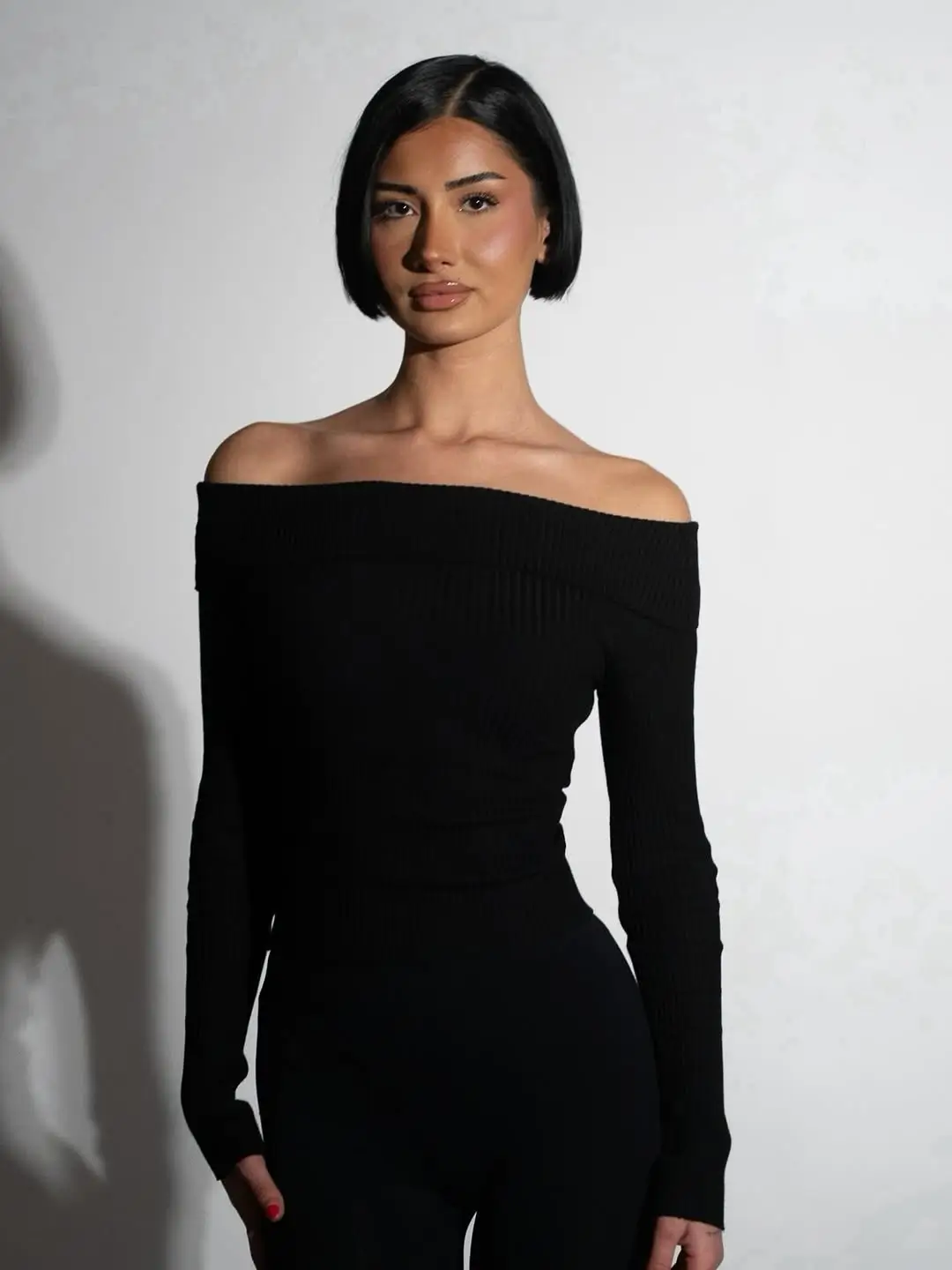 sleek summer bob haircut 2026 Ultra sleek tucked bob with deep side part