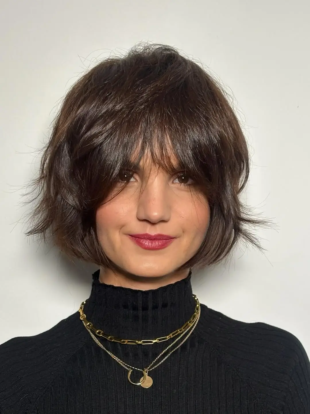 sleek summer bob haircut 2026 Textured layered bob with airy volume