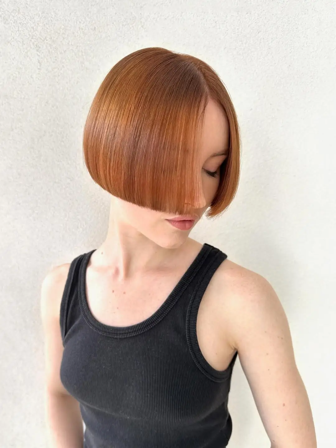 sleek summer bob haircut 2026 Sharp angled bob with sleek precision