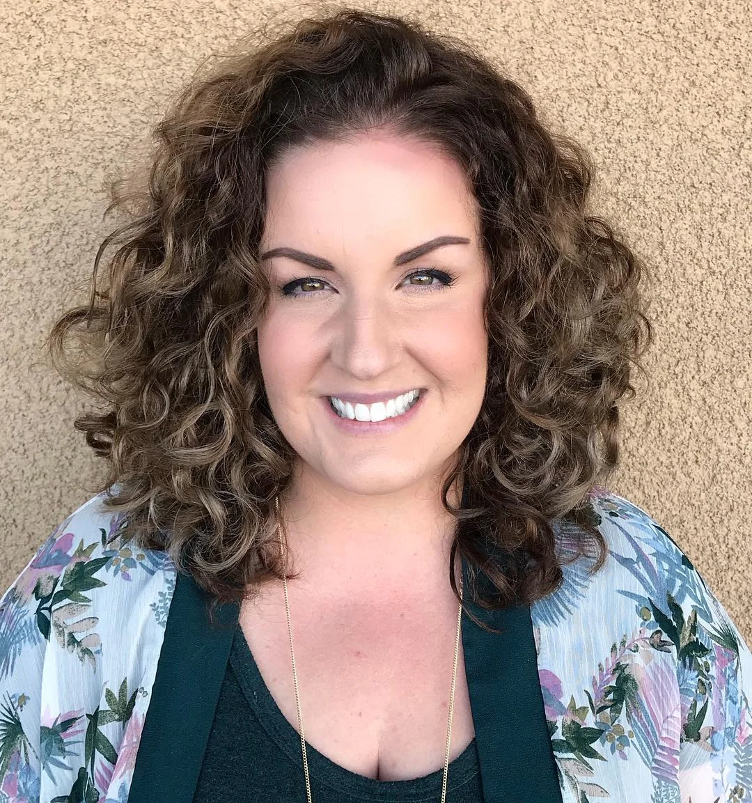 slimming summer haircuts for plus size women 2026 Voluminous Curly Shag That Brings Movement and Confidence