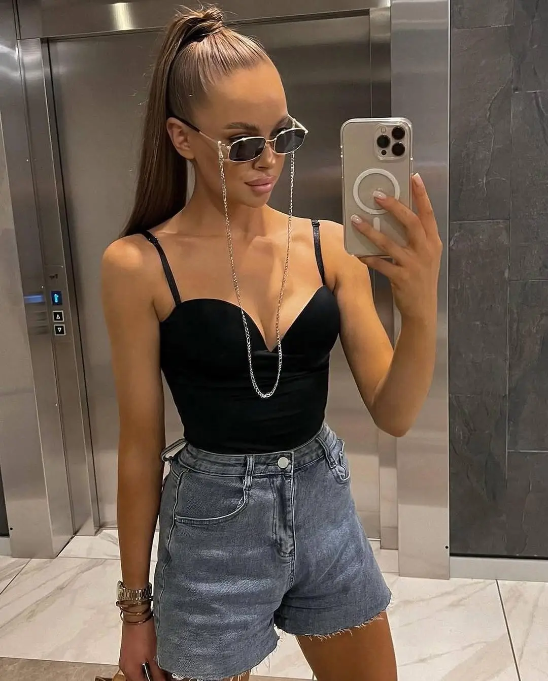 summer bodysuit outfits for women 2026 Black bodysuit with denim shorts that defines effortless baddie energy