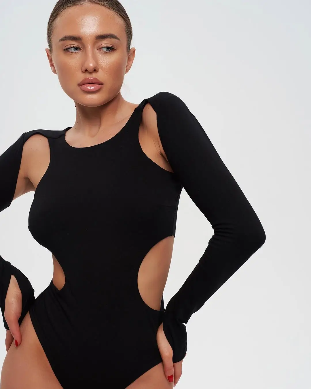 summer bodysuit outfits for women 2026 Sculpted black cut out bodysuit that feels bold yet refined