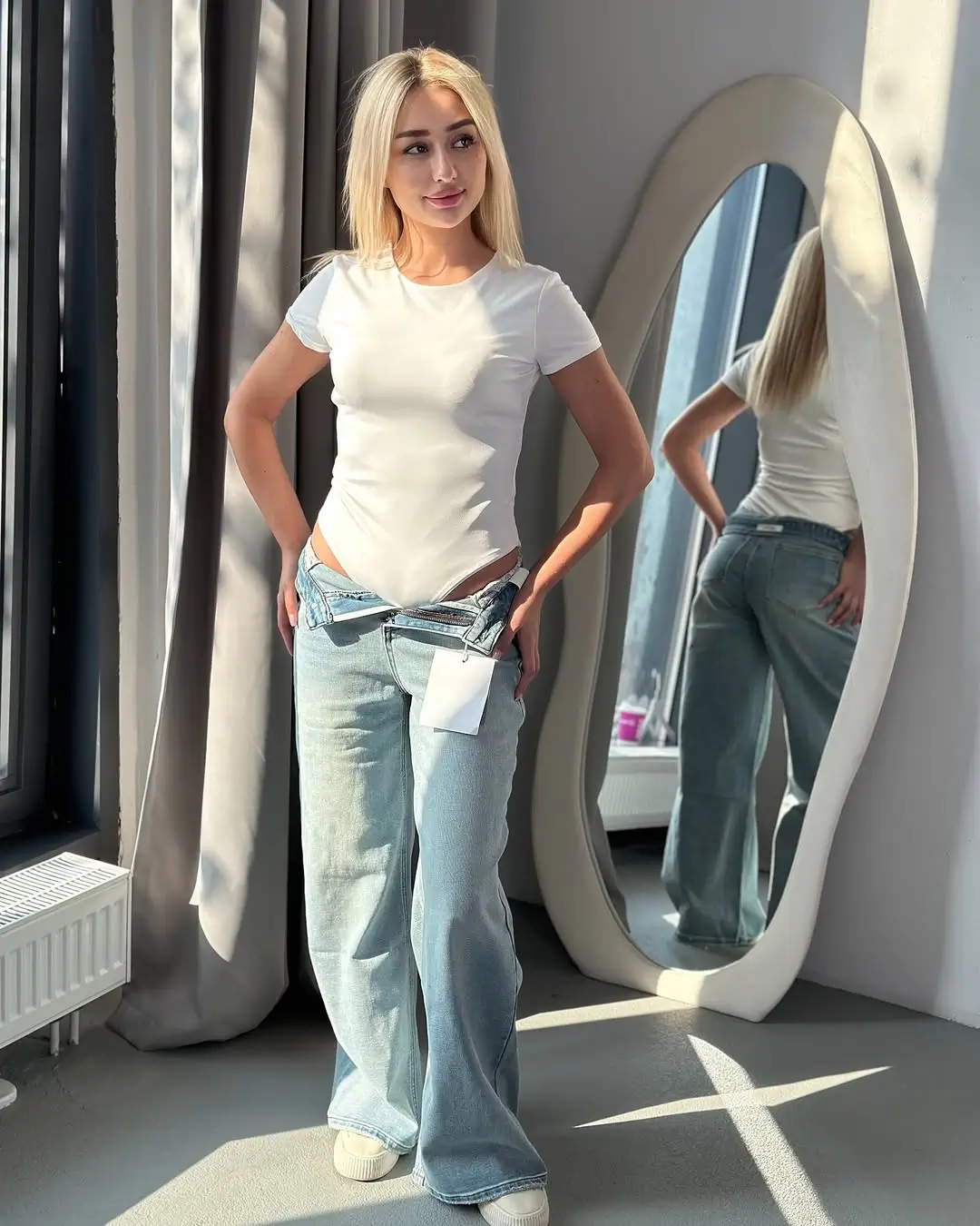 summer bodysuit outfits for women 2026 Classic white fitted bodysuit styled with relaxed jeans