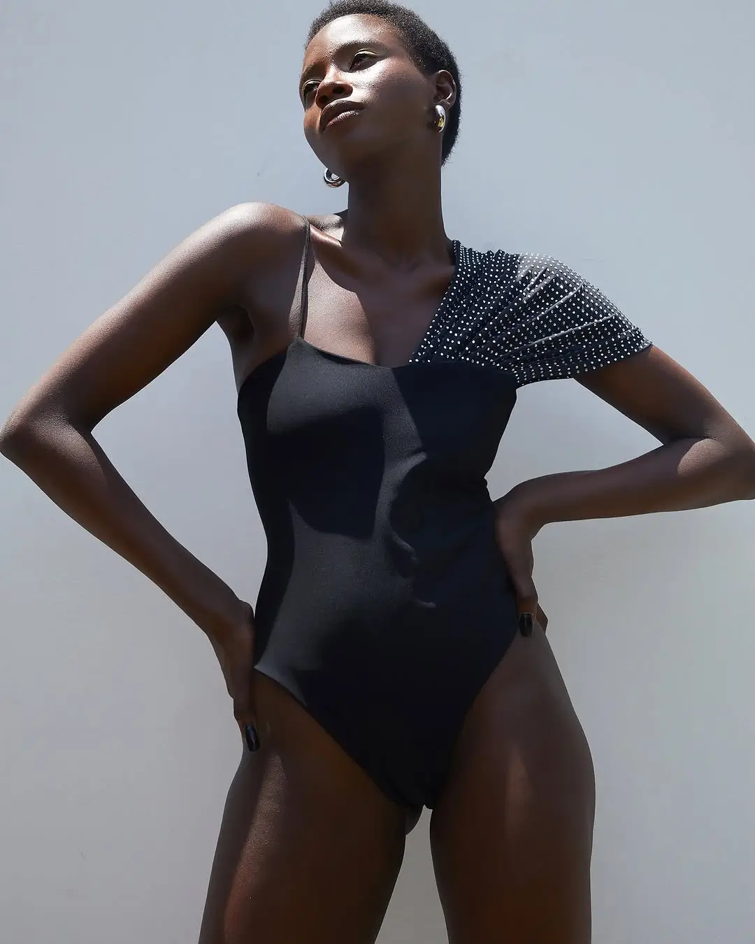 summer bodysuit outfits for women 2026 One shoulder black statement that feels instantly powerful