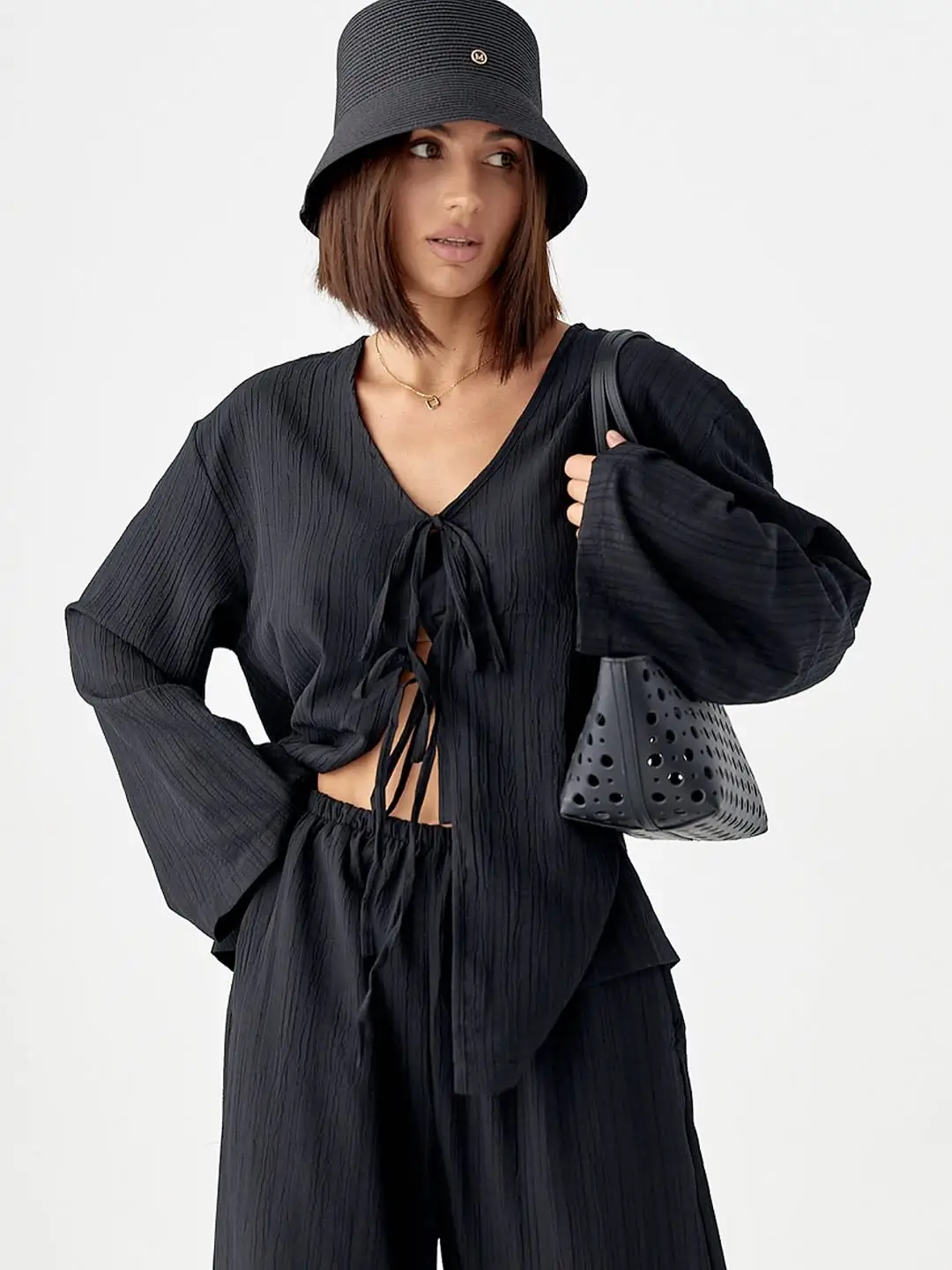 summer outfits for women 2026 All Black Texture with a Bold Minimal Attitude