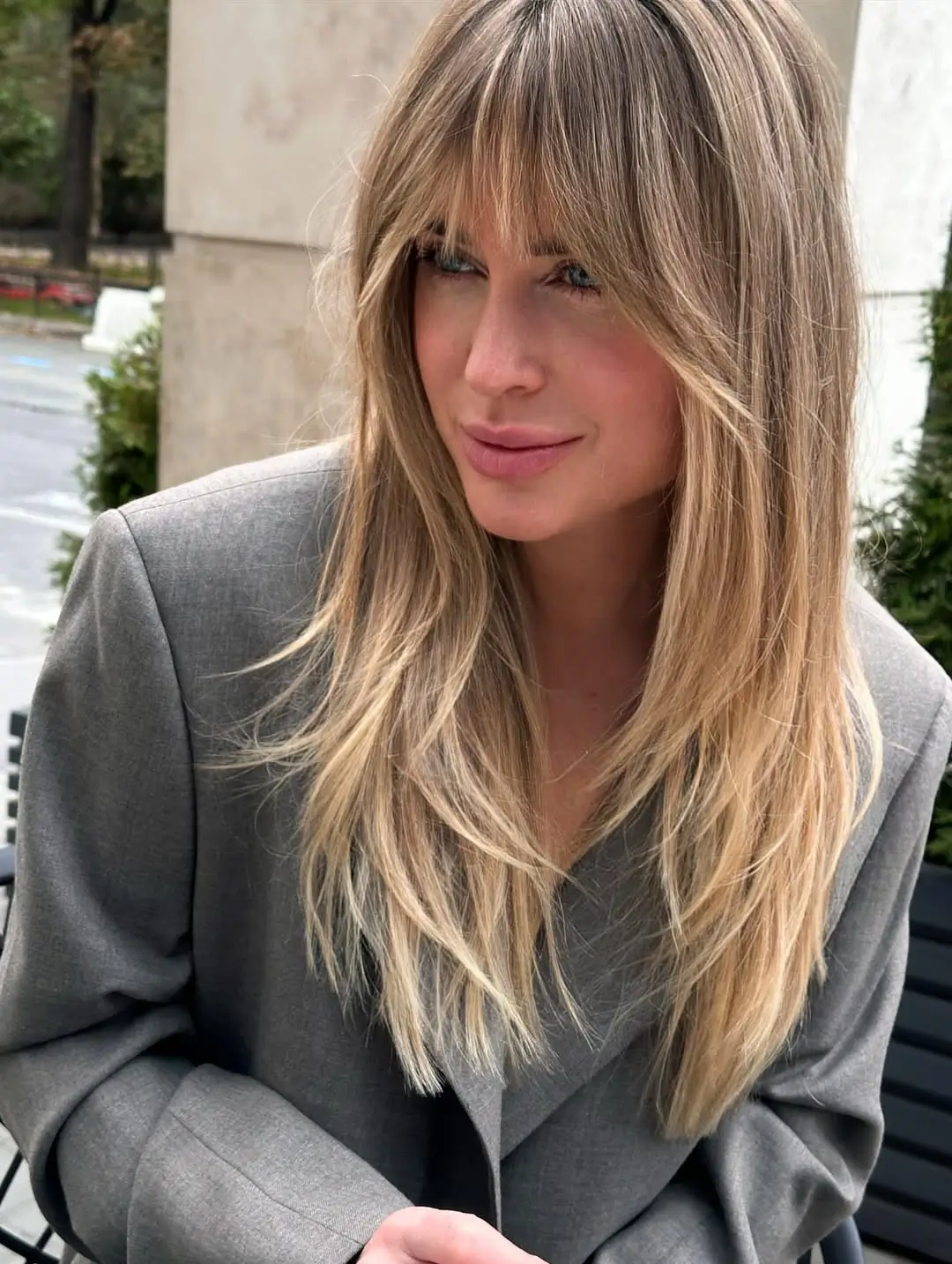 textured summer haircuts for long hair 2026 Airy Butterfly Layers with Curtain Bang Energy