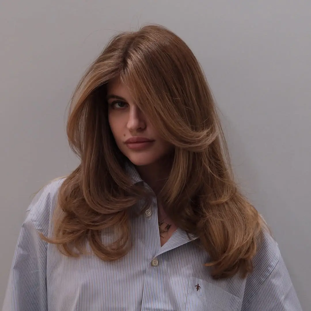 textured summer haircuts for long hair 2026 Rounded Blowout Layers with a Vintage Flip Feel
