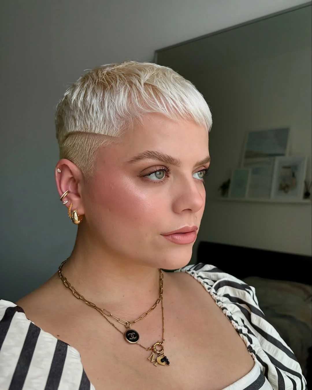 textured summer pixie haircuts 2026 Platinum Undercut Pixie with Sharp Contrast