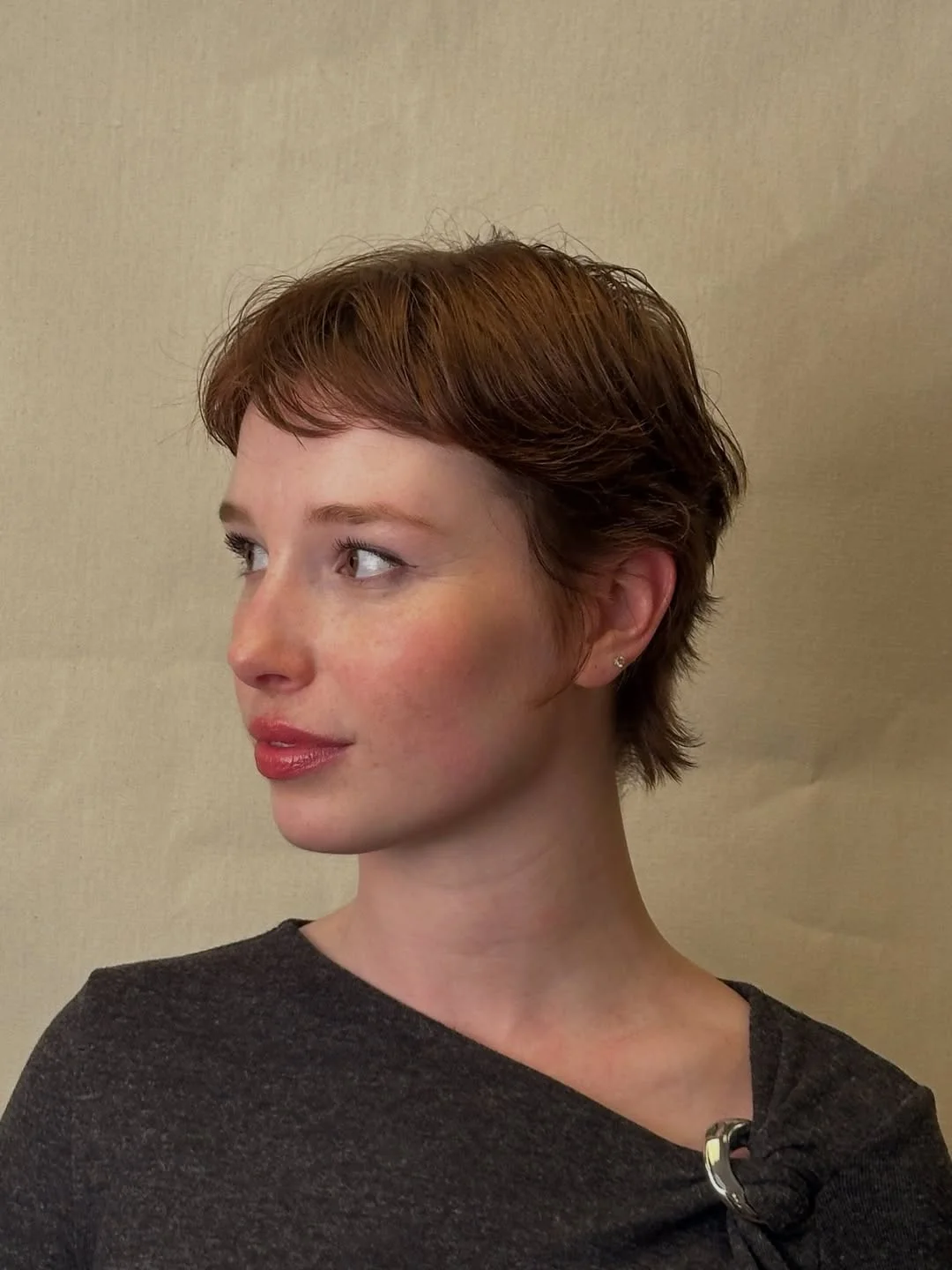 textured summer pixie haircuts 2026 Soft Auburn Pixie with Feathered Edges
