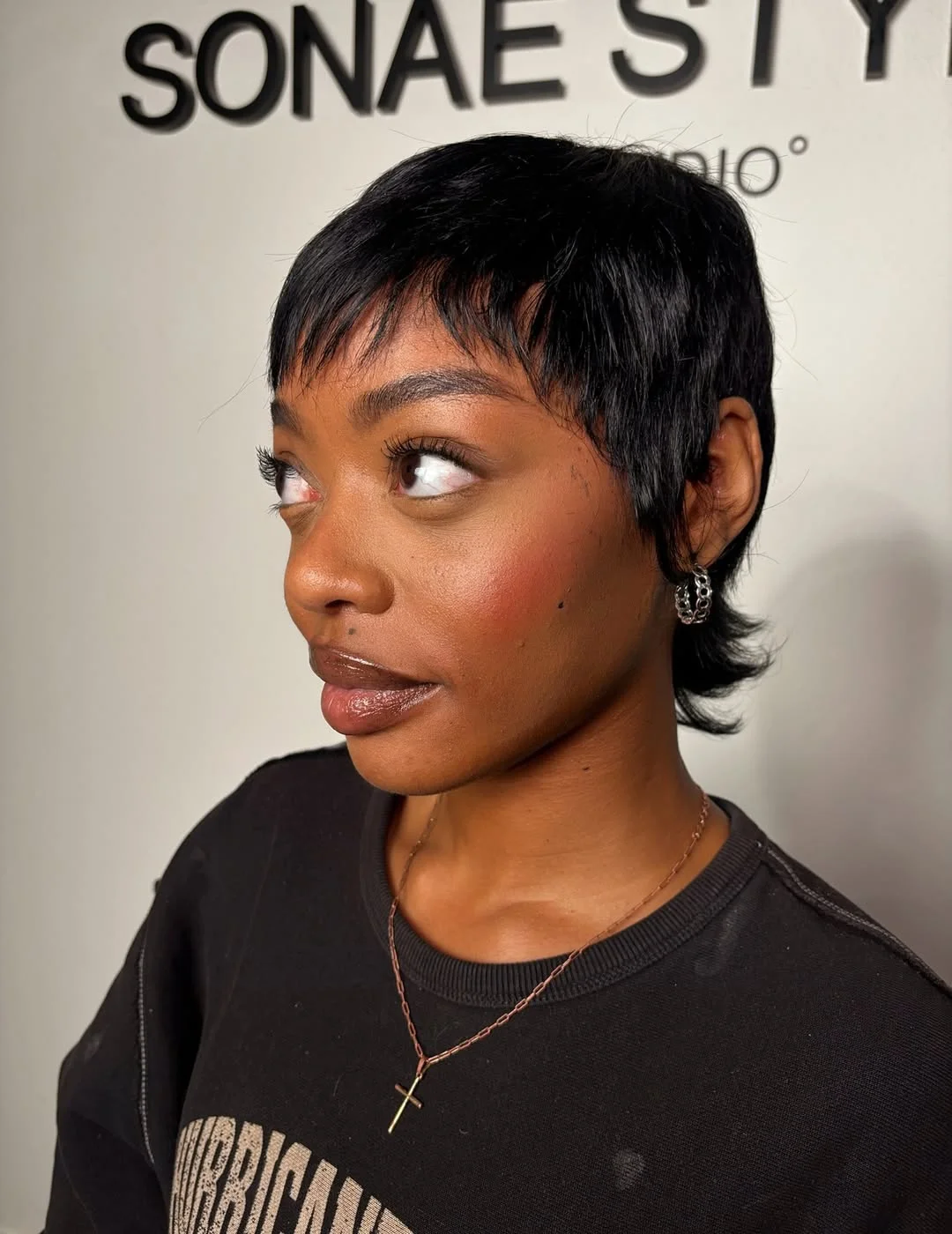 textured summer pixie haircuts 2026 Textured Jet Black Pixie with Tapered Nape