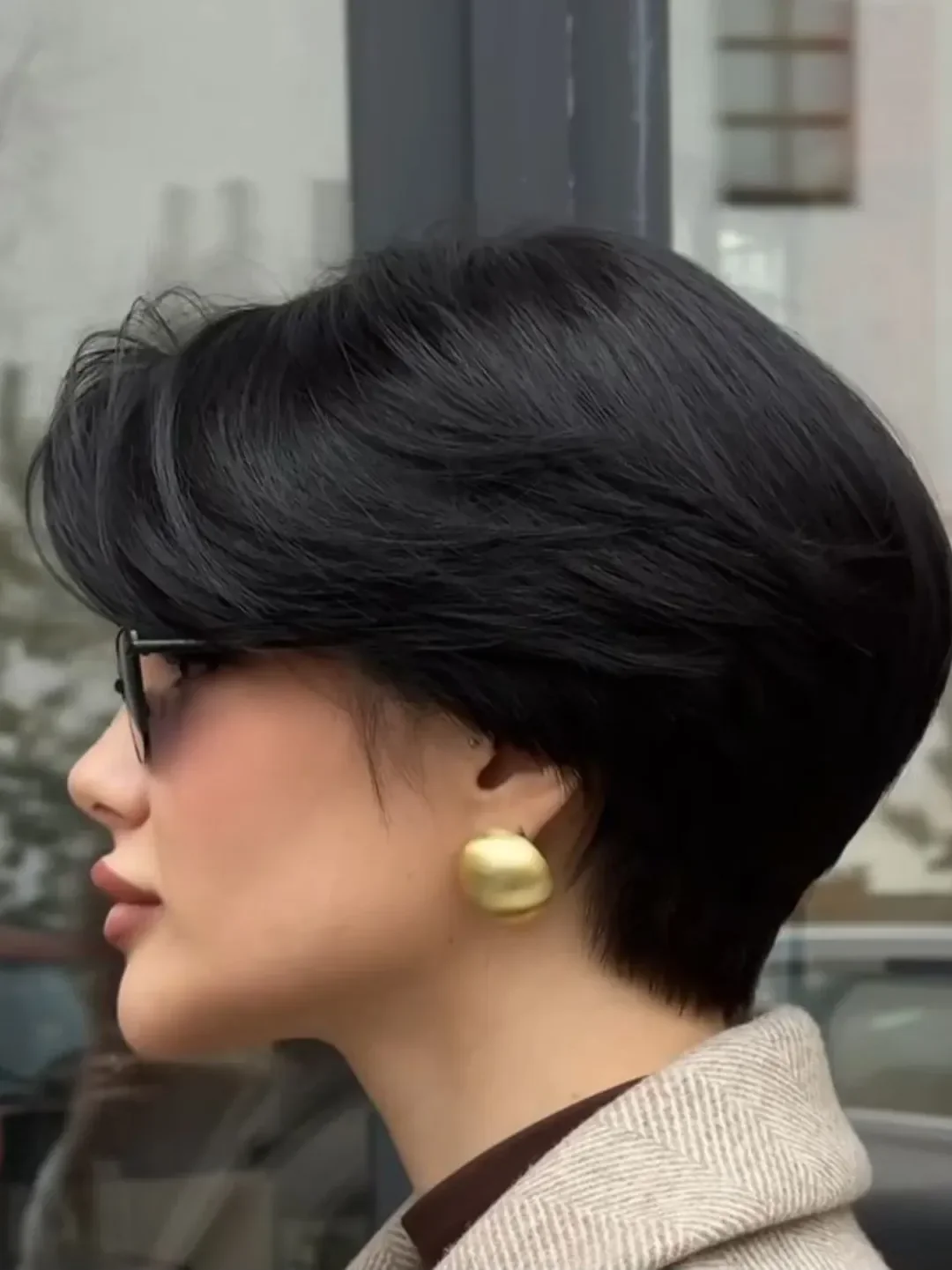 textured summer pixie haircuts 2026 Sleek Dark Pixie Bob Hybrid