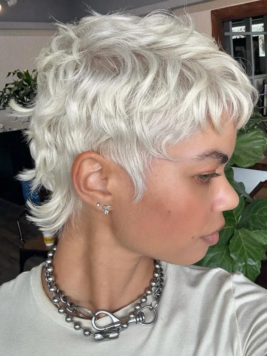 textured summer pixie haircuts 2026 Choppy Platinum Pixie Mullet Blend