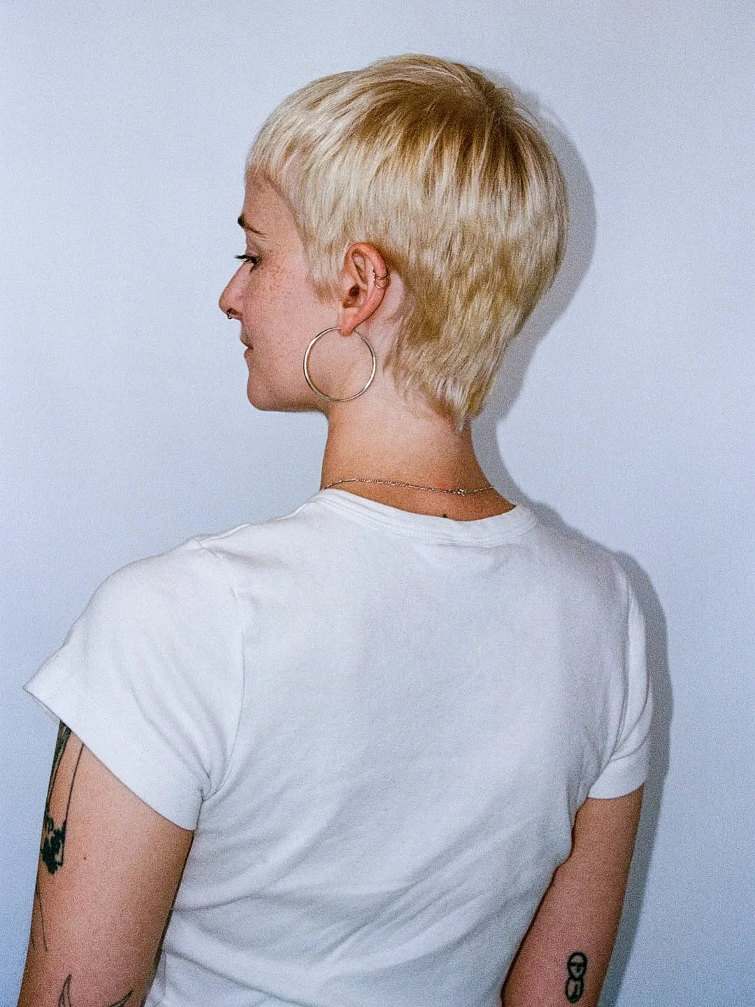 textured summer pixie haircuts 2026 Classic Blonde Tapered Pixie with Clean Nape