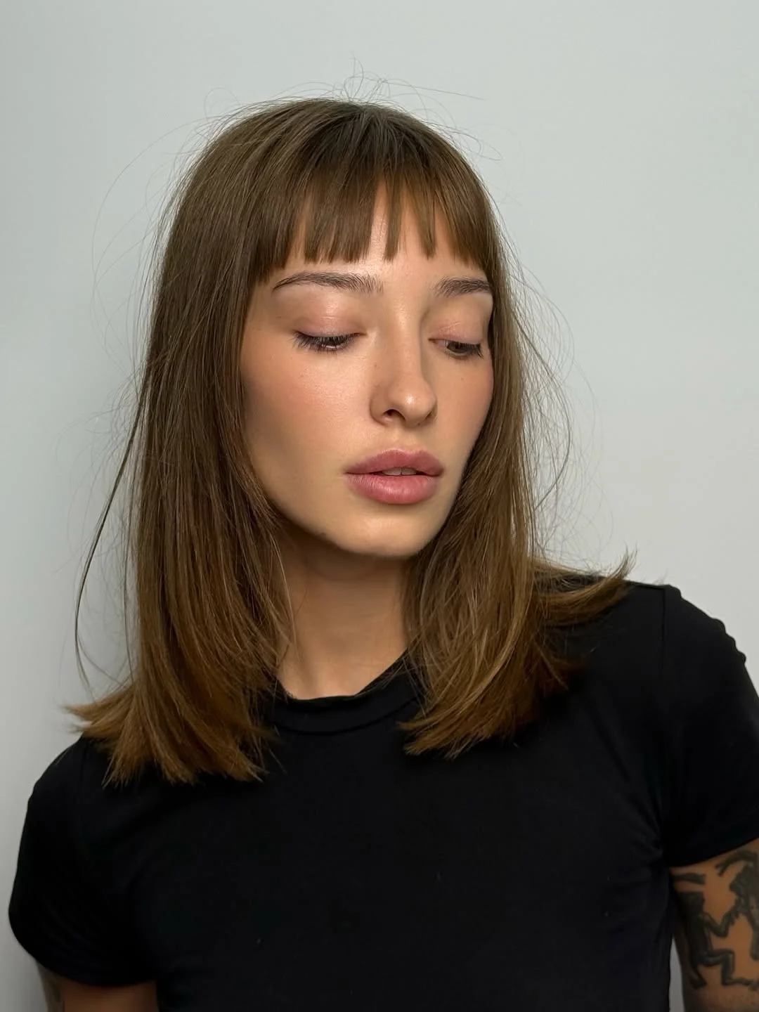 versatile summer haircuts for medium hair 2026 Soft Layered Bob with Micro Bangs Energy