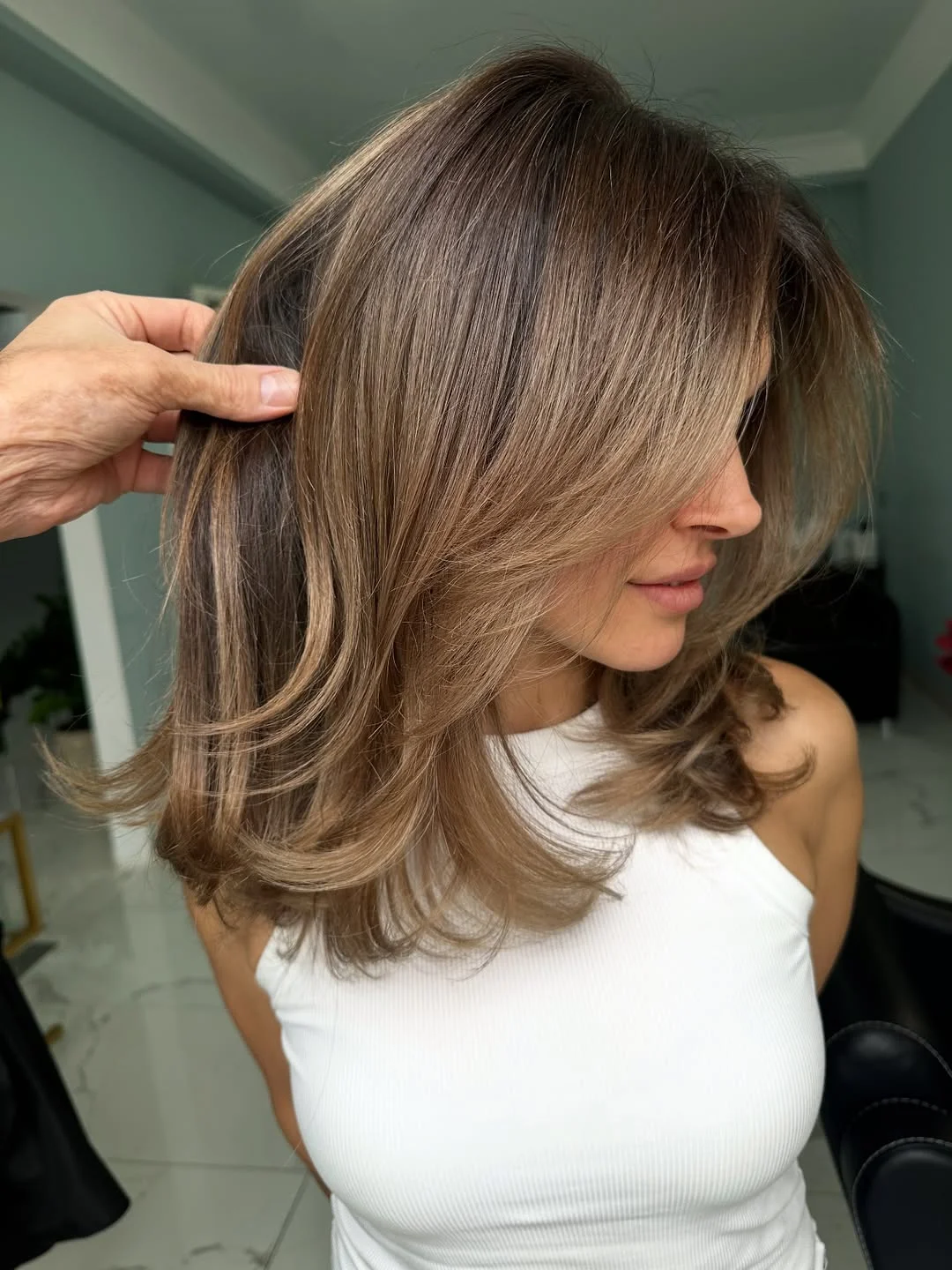 versatile summer haircuts for medium hair 2026 Choppy Layered Blowout with Modern Butterfly Movement